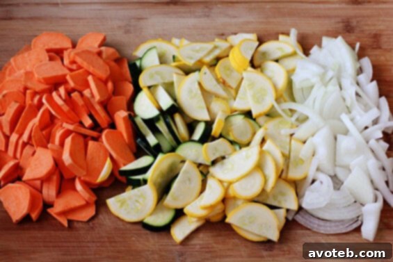 Sweet potato and zucchini hash cooking in a skillet
