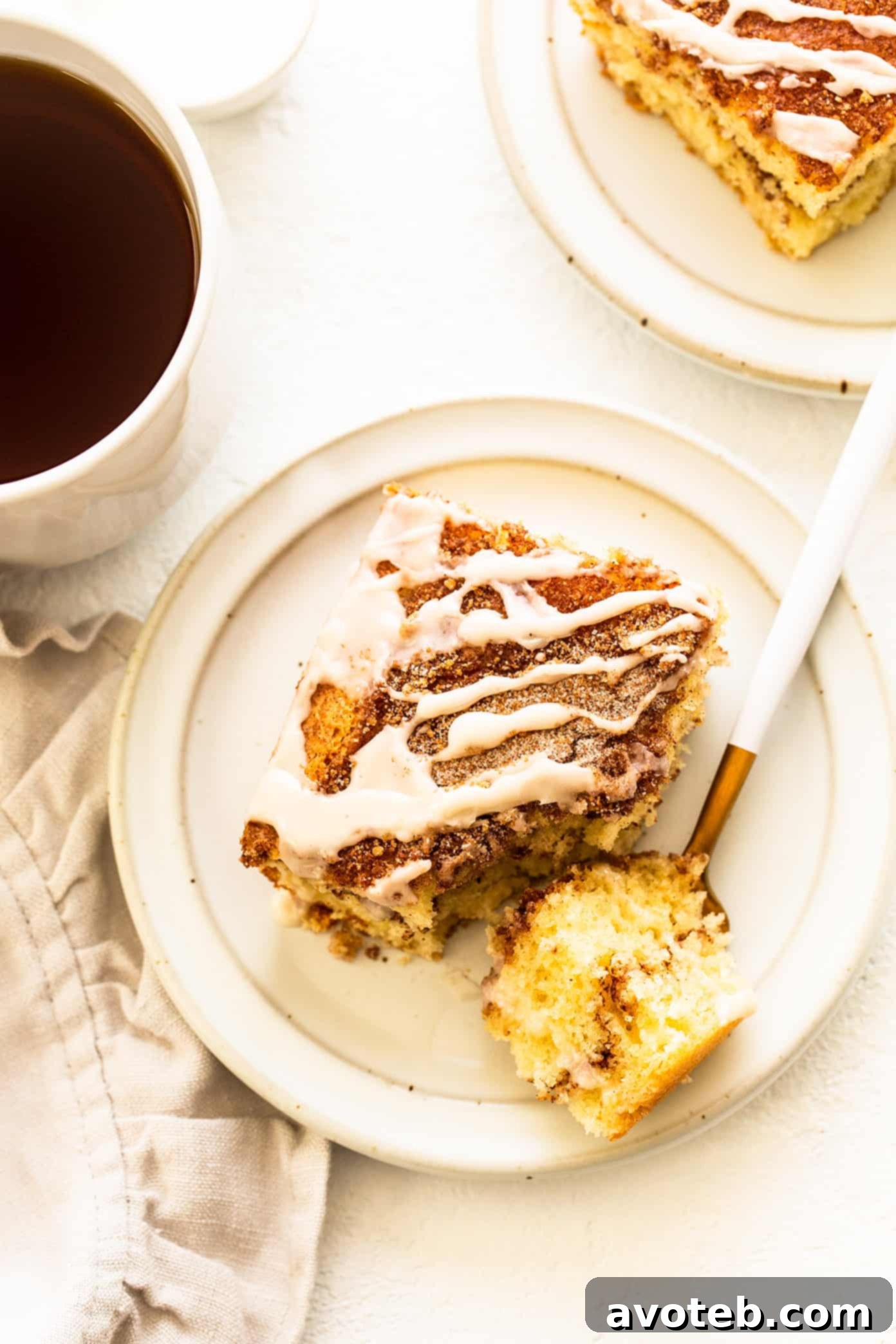 Close-up of a slice of sour cream coffee cake with glaze