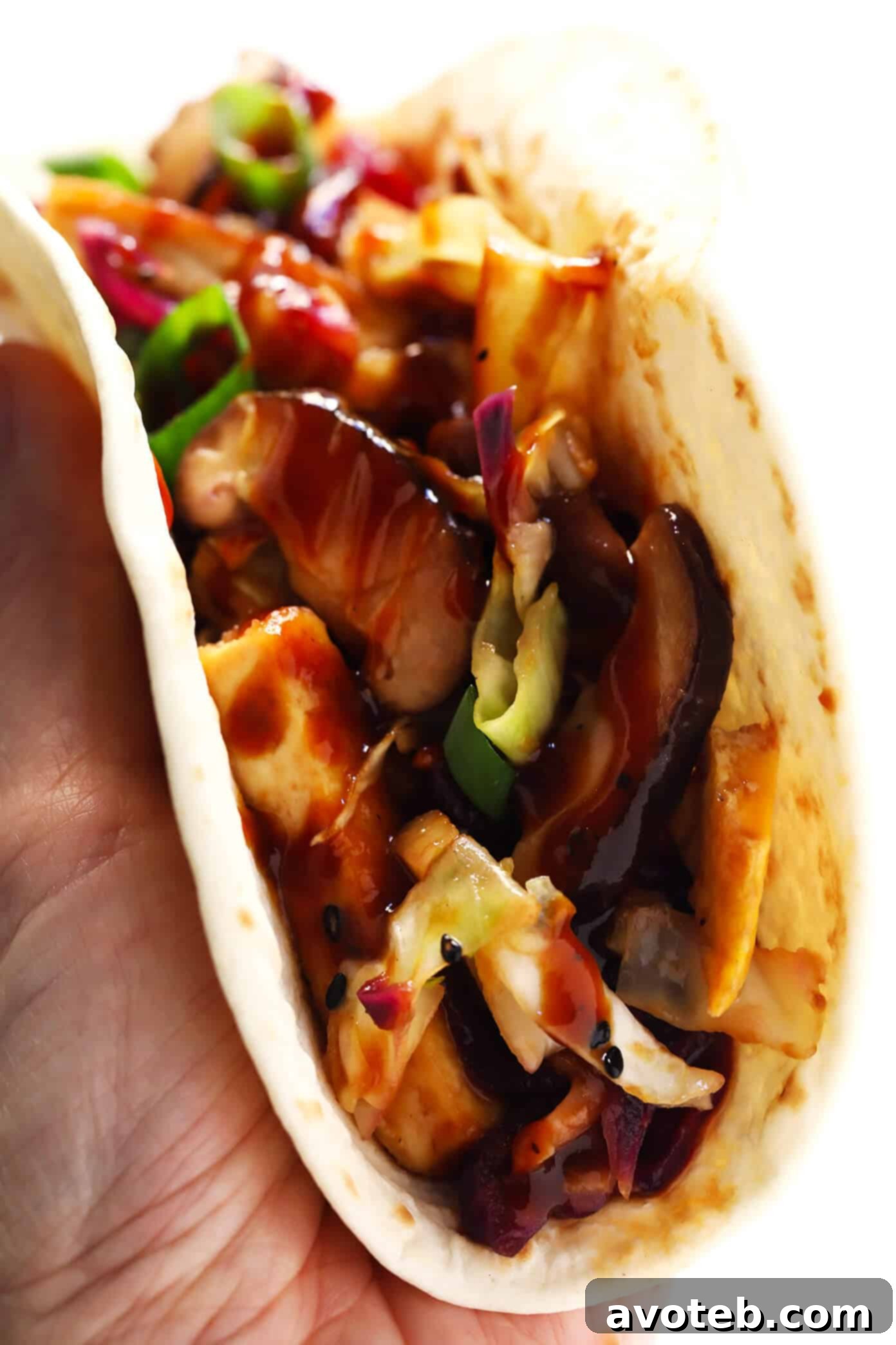Vegetarian Moo Shu "Tacos" - Individual servings wrapped in tortillas, ready to be enjoyed.