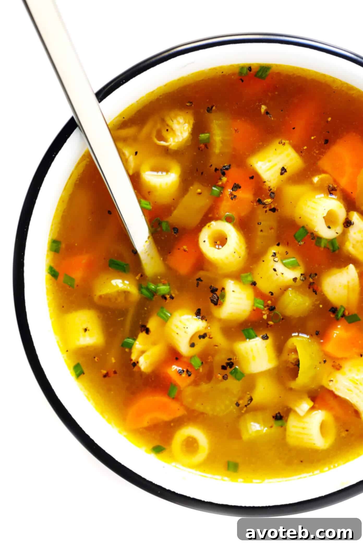 Appetizing bowl of Pepperoncini Chicken Noodle Soup with fresh green garnish
