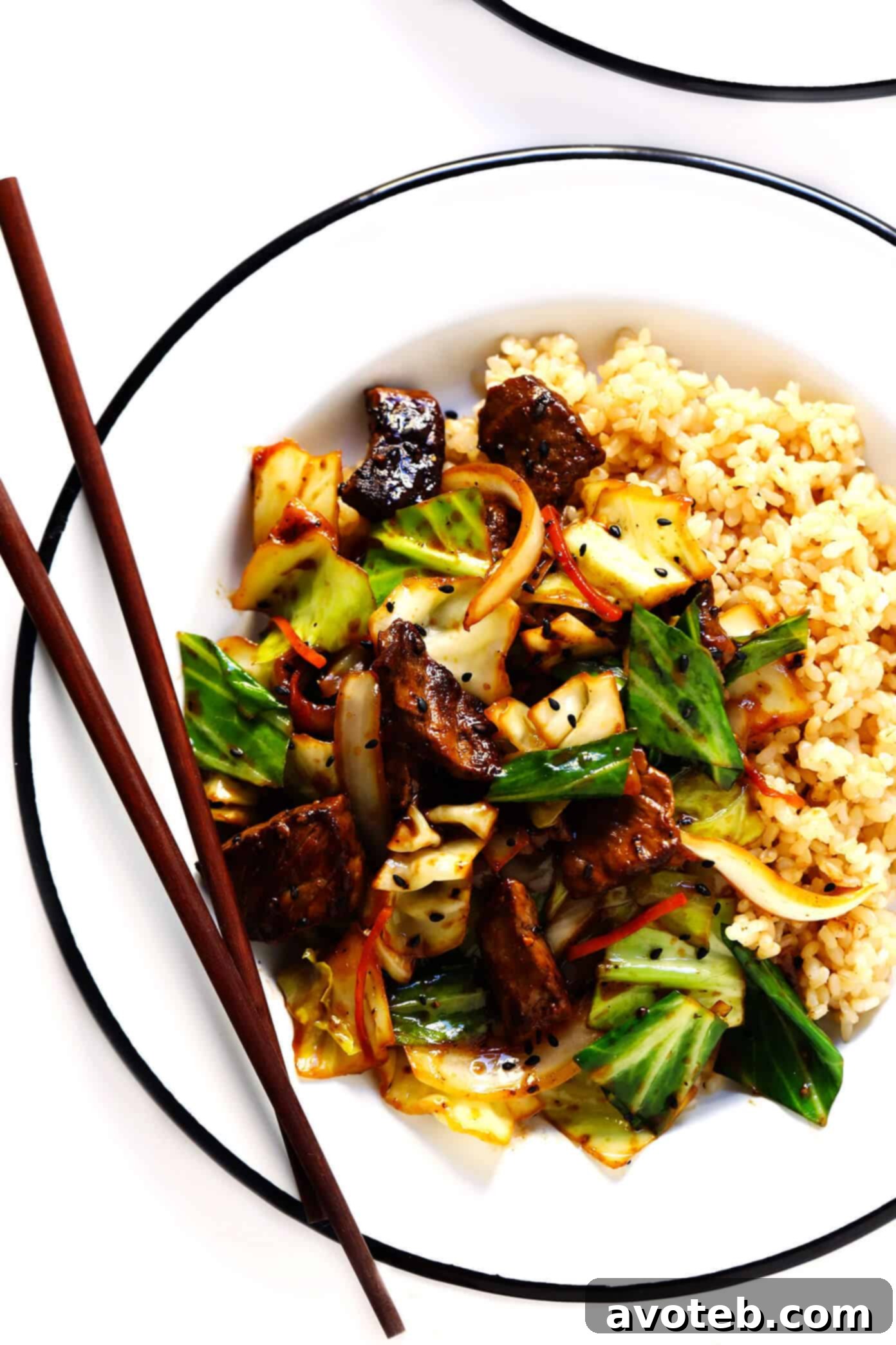Ginger Beef and Cabbage Stir-Fry with brown rice and green onions