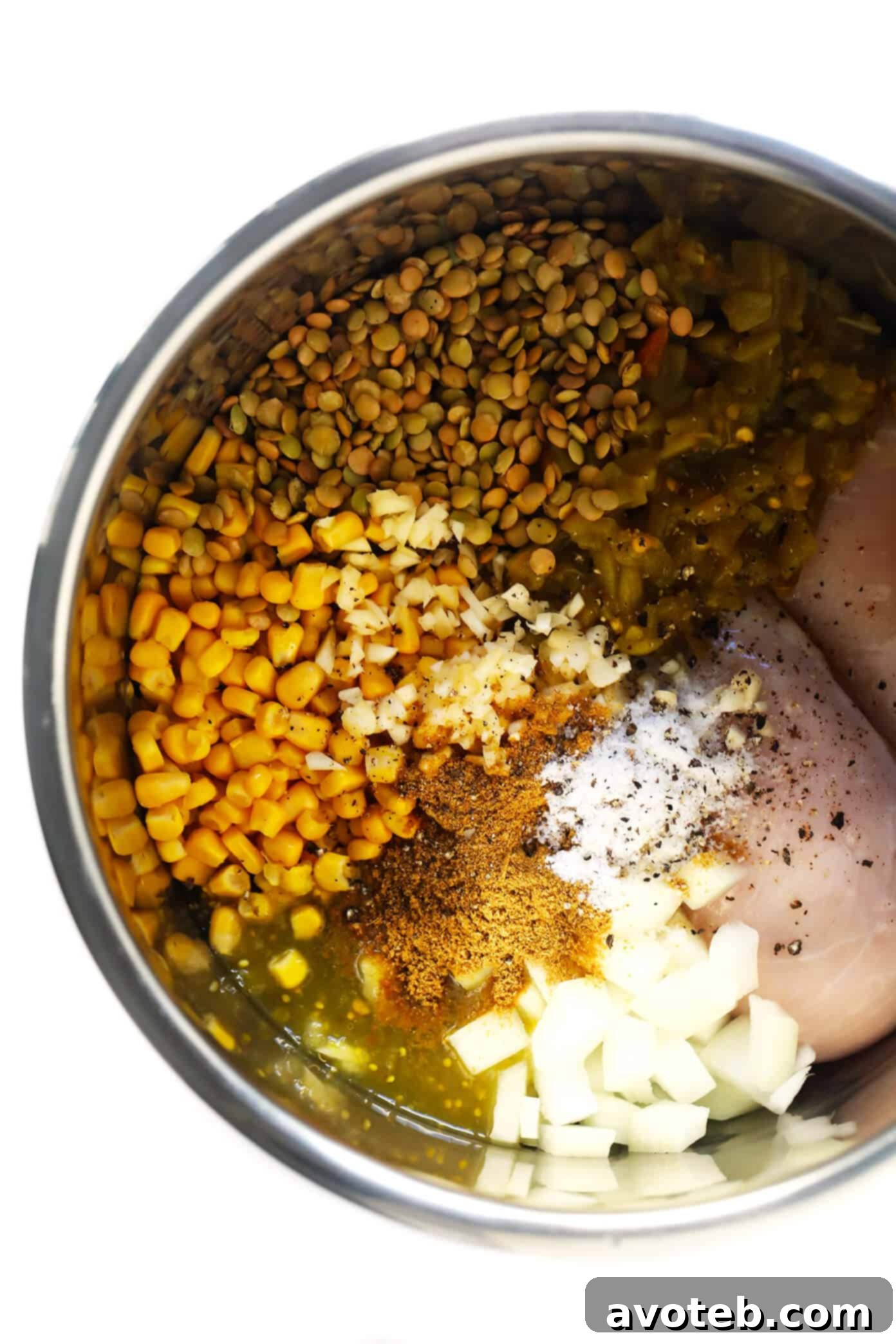 Mexican Chicken Lentil Soup cooking in an Instant Pot, showing its vibrant ingredients.