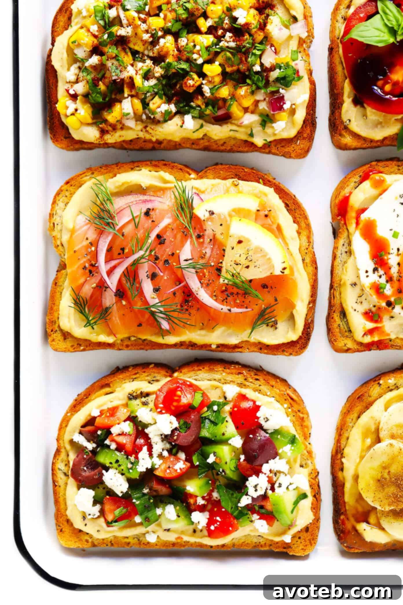 A collection of various hummus toast slices, beautifully arranged and ready to be enjoyed.