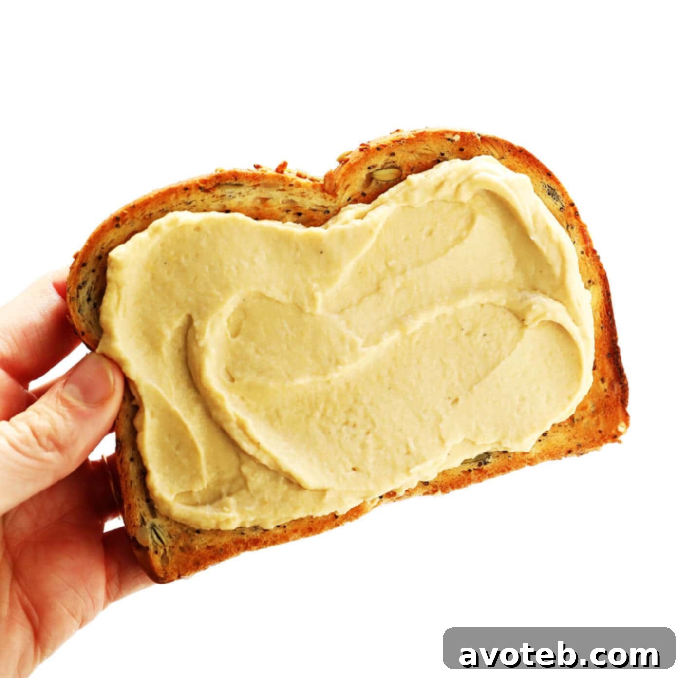 A vibrant selection of various hummus toast creations, showcasing different topping combinations.
