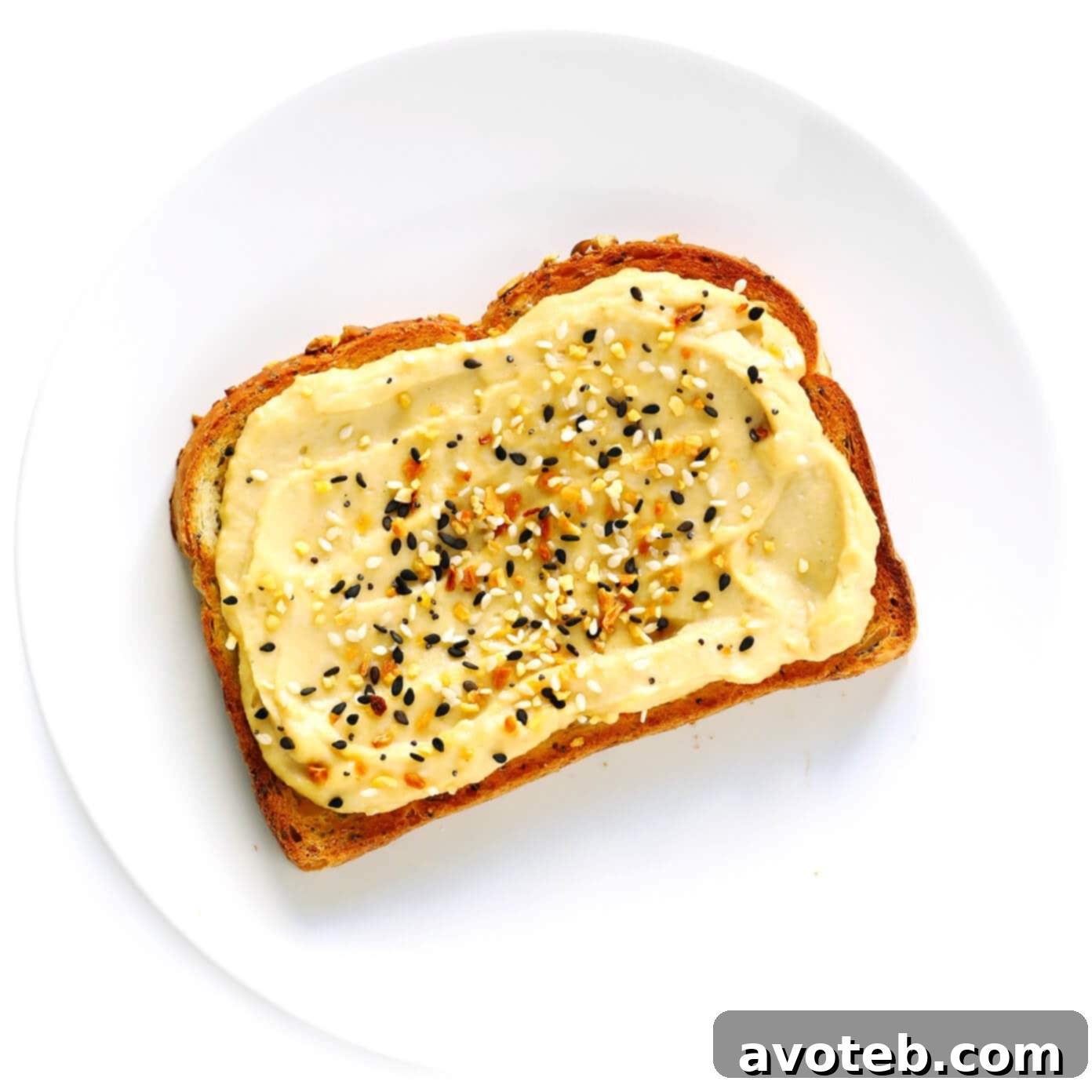Hummus Toast topped with a generous sprinkle of "Everything Bagel" seasoning.