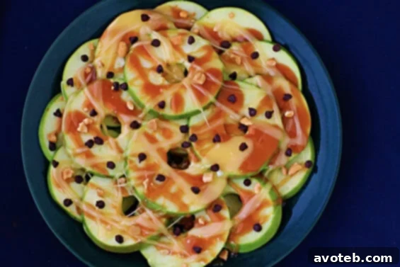 Delicious Apple Nachos with caramel, marshmallow, chocolate chips, and peanuts