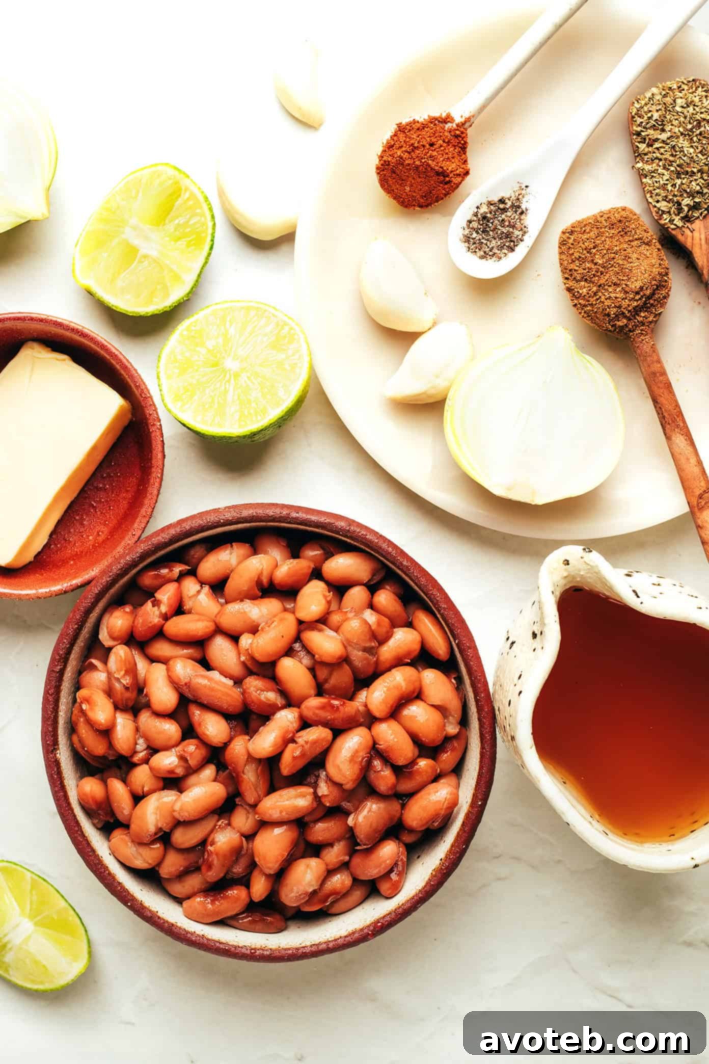 A vibrant overhead shot of refried beans with a spoon, highlighting their rich texture and appetizing appeal.
