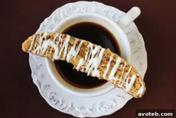 Stacked Pumpkin Pie Biscotti with white chocolate drizzle
