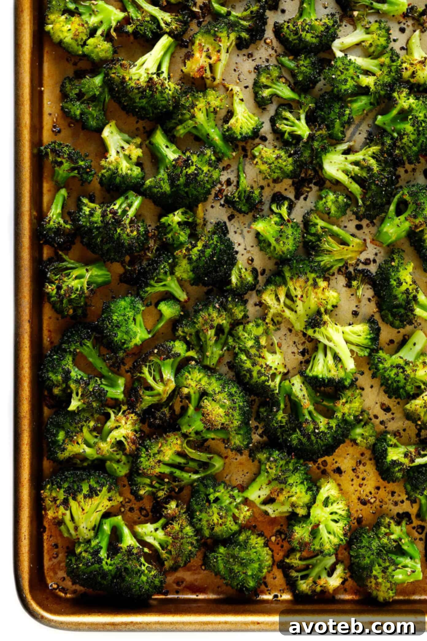 Perfectly roasted broccoli florets, crisp and tender with charred edges, ready to be added to a healthy grain bowl.
