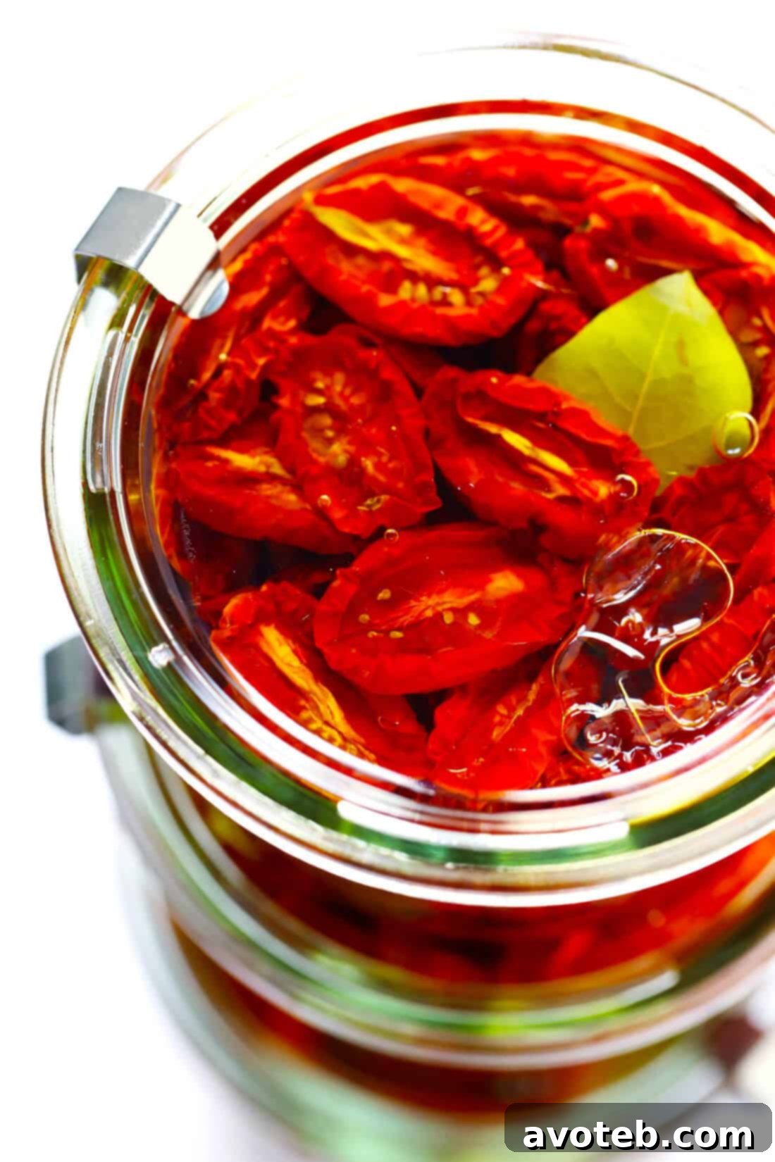 Learn how to make sun-dried tomatoes in the oven! This recipe can be easily customized to be as spicy, garlicky, herby or plain as you prefer. | gimmesomeoven.com #sundriedtomatoes #tomatoes #summer #topping #italian #healthy #vegan #glutenfree Sun-Dried Tomatoes in Weck Jars: Beautifully preserved oven-dried tomatoes in glass jars, showcasing their vibrant color and readiness for use.
