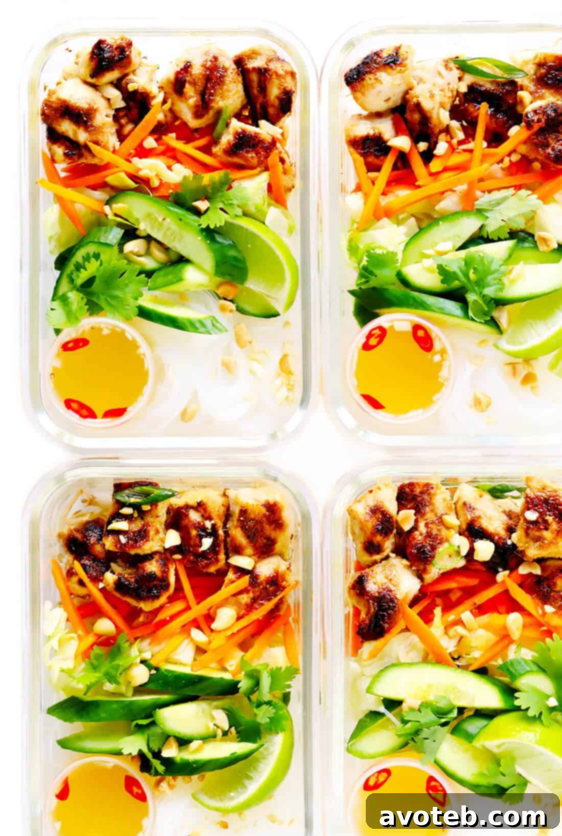 Vietnamese Chicken Noodle Bowls in meal prep containers, showcasing a healthy and convenient option for packed lunches or quick dinners throughout the week. The individual compartments keep ingredients fresh until assembly.