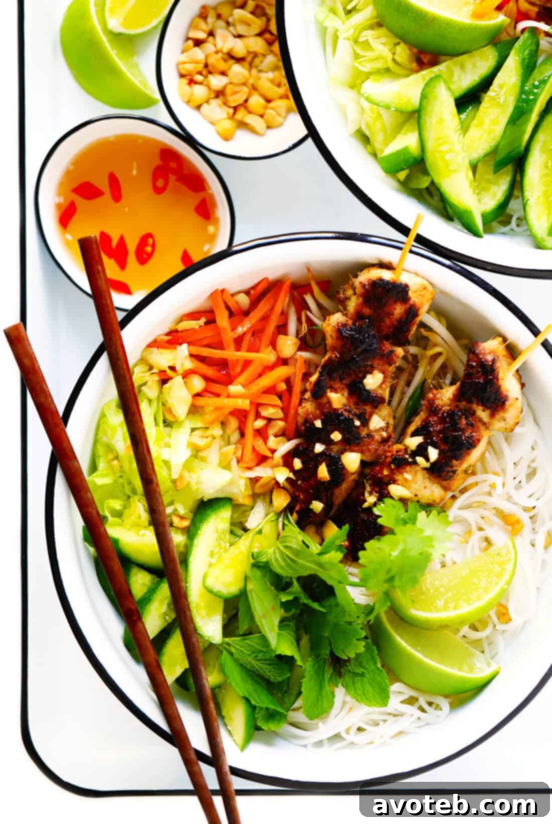 Vietnamese Bún Gà Nướng, a Chicken Noodle Bowl with Nuoc Cham sauce, captured close-up, highlighting the fresh ingredients, vibrant colors, and delicious textures of the dish ready to be enjoyed.