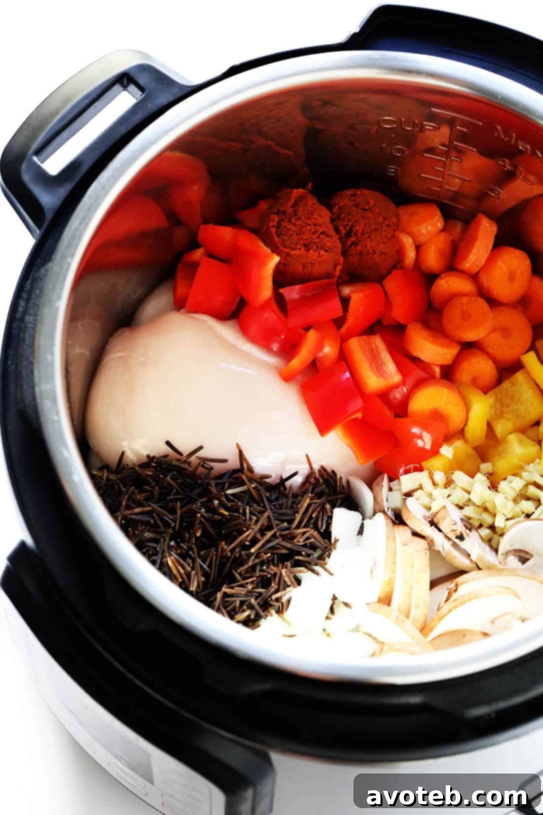 Thai Curry Wild Rice Soup Ingredients: A visual guide to bell peppers, carrots, onion, mushrooms, chicken, wild rice, and Thai curry paste for a wholesome soup.