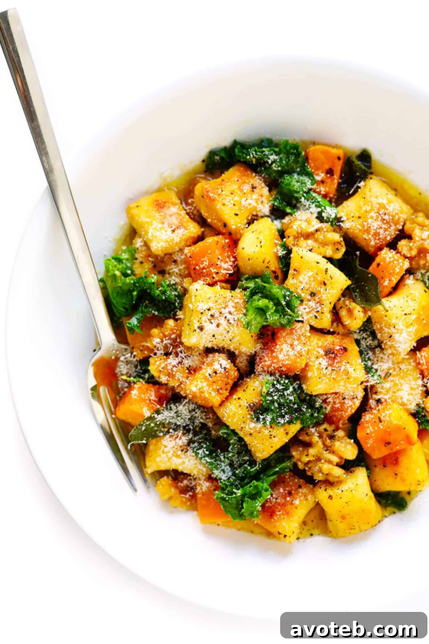 Toasted gnocchi, roasted butternut squash, garlicky kale and walnuts are all tossed together in the yummiest sage brown butter sauce and Parmesan cheese. It's total fall comfort food...and surprisingly easy to make too! | gimmesomeoven.com #gnocchi #italian #dinner #butternutsquash #fall #healthy #vegetarian Gnocchi with Roasted Butternut Squash, Kale and Sage Brown Butter Sauce