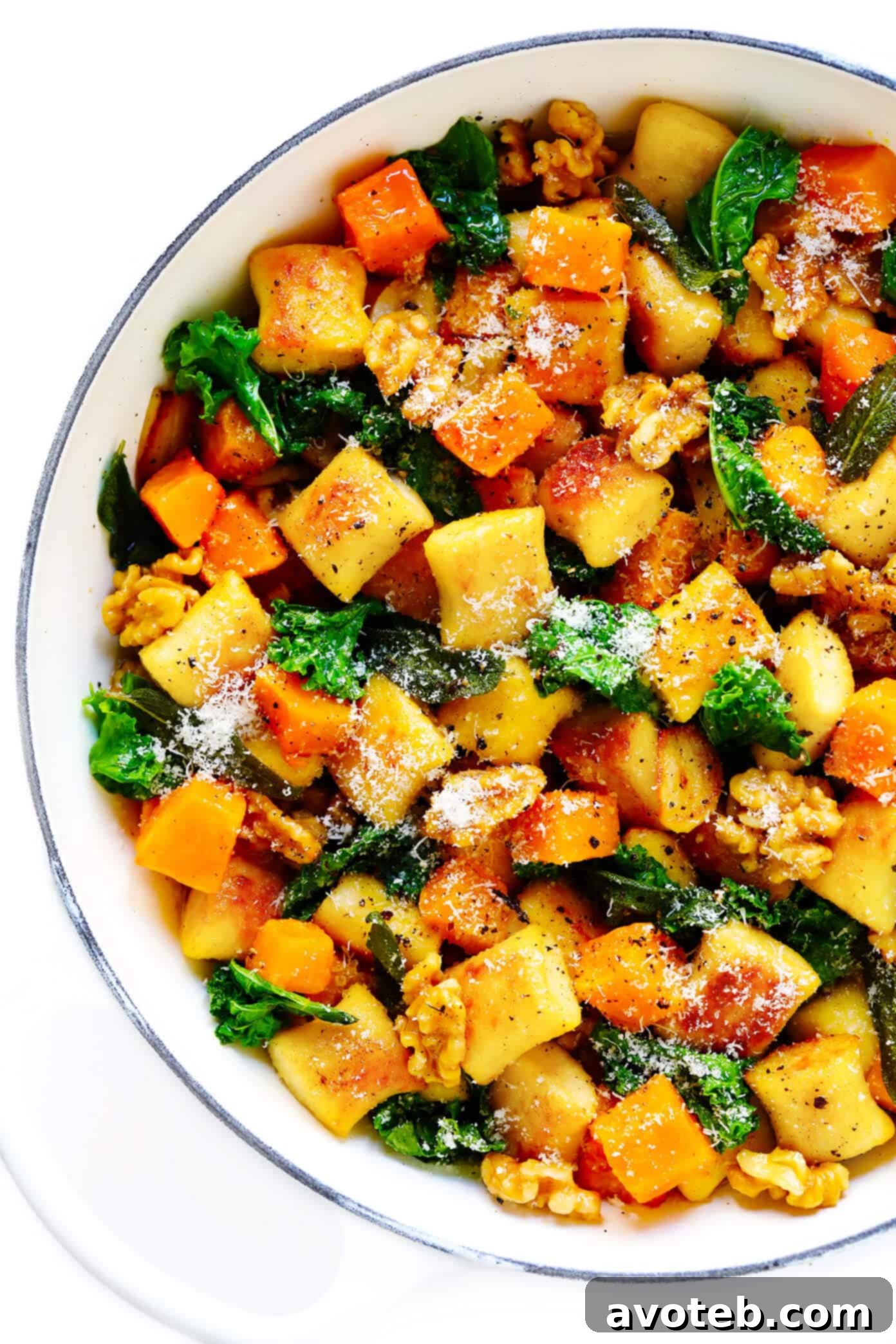 Toasted gnocchi, roasted butternut squash, garlicky kale and walnuts are all tossed together in the yummiest sage brown butter sauce and Parmesan cheese. It's total fall comfort food...and surprisingly easy to make too! | gimmesomeoven.com #gnocchi #italian #dinner #butternutsquash #fall #healthy #vegetarian Gnocchi with Butternut Squash, Kale, Parmesan and Sage Brown Butter Sauce