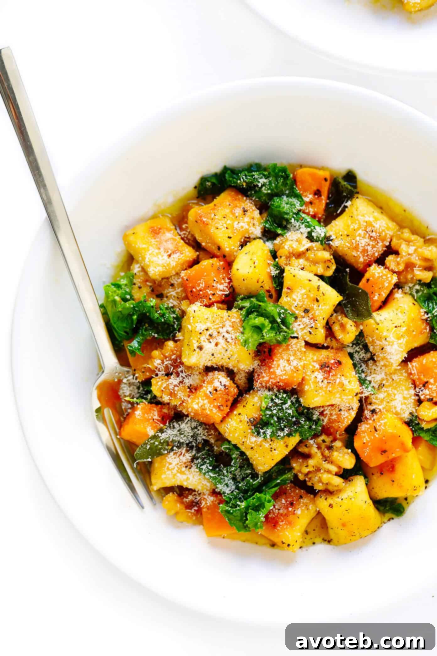 Toasted gnocchi, roasted butternut squash, garlicky kale and walnuts are all tossed together in the yummiest sage brown butter sauce and Parmesan cheese. It's total fall comfort food...and surprisingly easy to make too! | gimmesomeoven.com #gnocchi #italian #dinner #butternutsquash #fall #healthy #vegetarian Autumn Gnocchi with Kale, Butternut Squash, and Brown Butter Sauce
