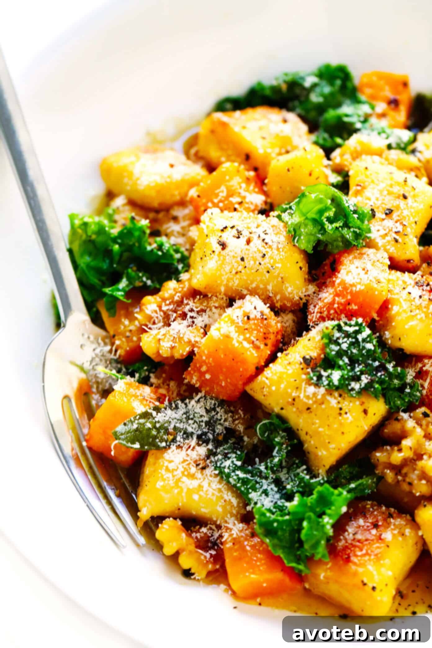 Toasted gnocchi, roasted butternut squash, garlicky kale and walnuts are all tossed together in the yummiest sage brown butter sauce and Parmesan cheese. It's total fall comfort food...and surprisingly easy to make too! | gimmesomeoven.com #gnocchi #italian #dinner #butternutsquash #fall #healthy #vegetarian Toasted Gnocchi with Roasted Butternut Squash, Kale, Parmesan, Walnuts and Sage Brown Butter Sauce
