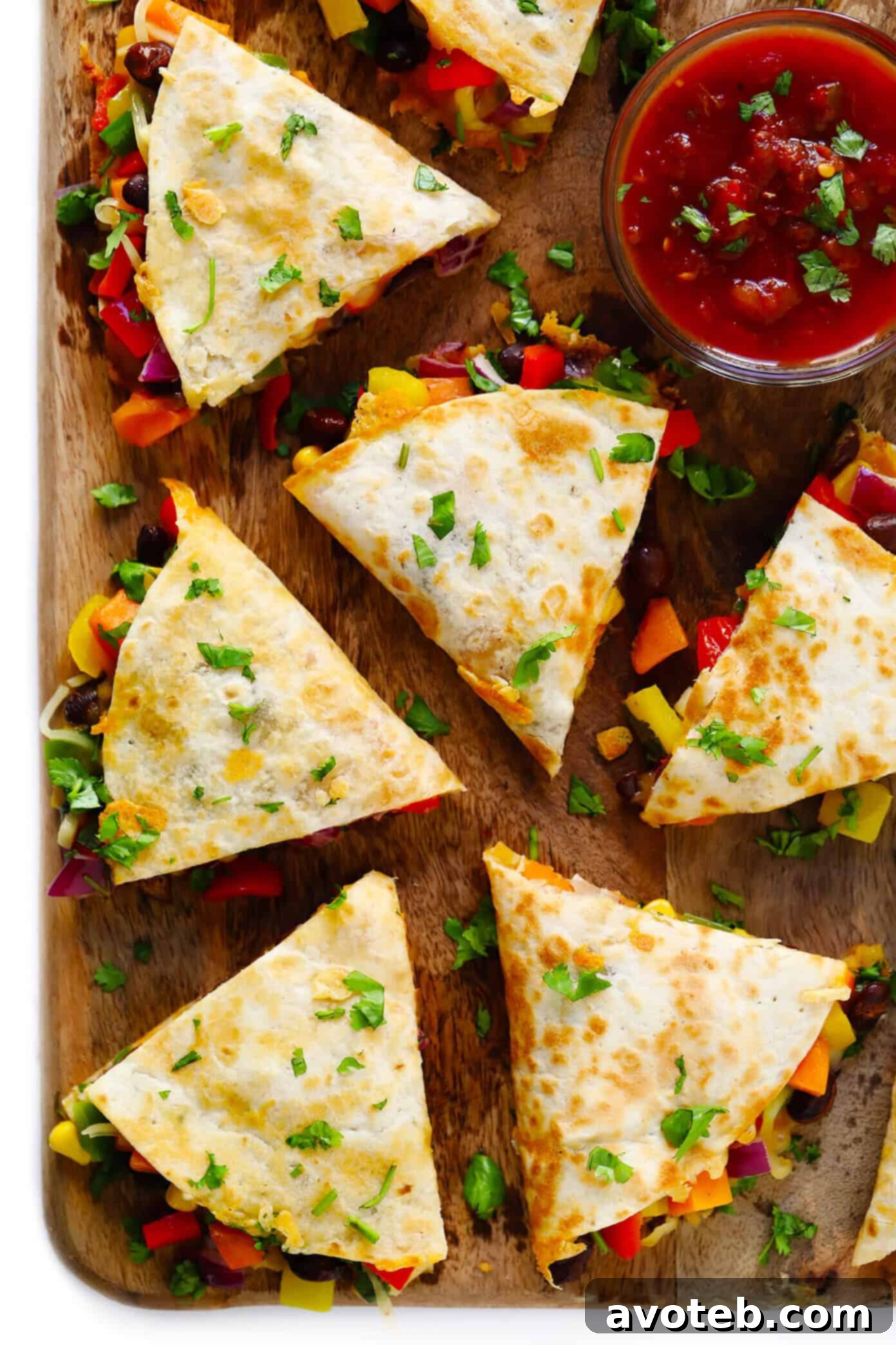 This easy veggie quesadilla recipe is 100% customizable with whatever veggies you happen to have on hand. Feel free to add in an extra protein (such as chicken, beef or shrimp) if you'd like, and use whatever kind of tortillas and cheese you prefer. | gimmesomeoven.com #quesadilla #vegetarian #veggie #dinner #healthy #mexican #mealprep #freezermeal Vegetarian Quesadilla filling with cheese, ready to be folded