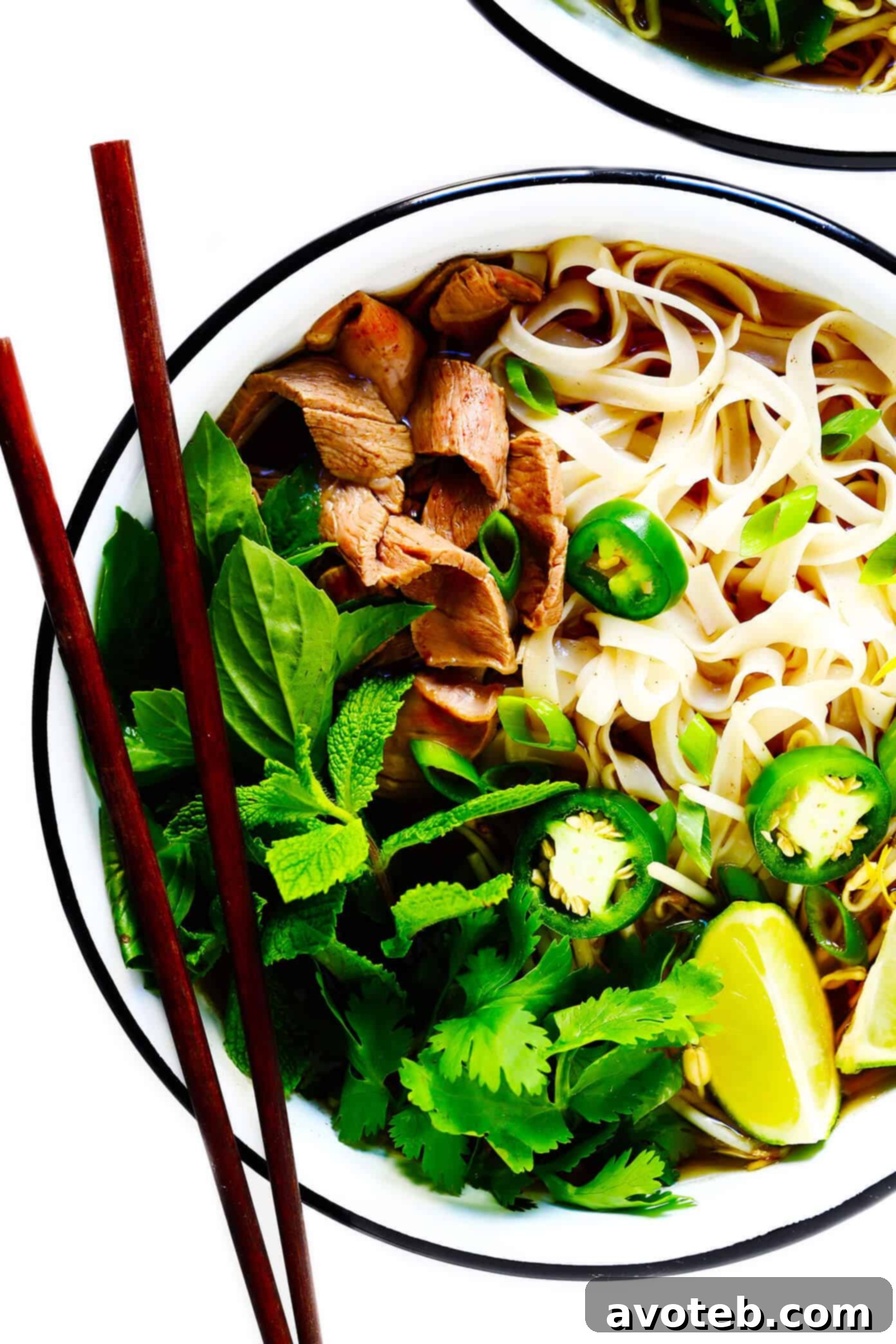 Savor the taste of Vietnam with this homemade pho recipe, featuring a deeply savory broth, delicate rice noodles, your choice of protein (beef, chicken, pork, or shrimp), and an abundance of fresh, vibrant toppings. A naturally gluten-free and truly satisfying dinner idea. Delicious Homemade Vietnamese Pho Recipe