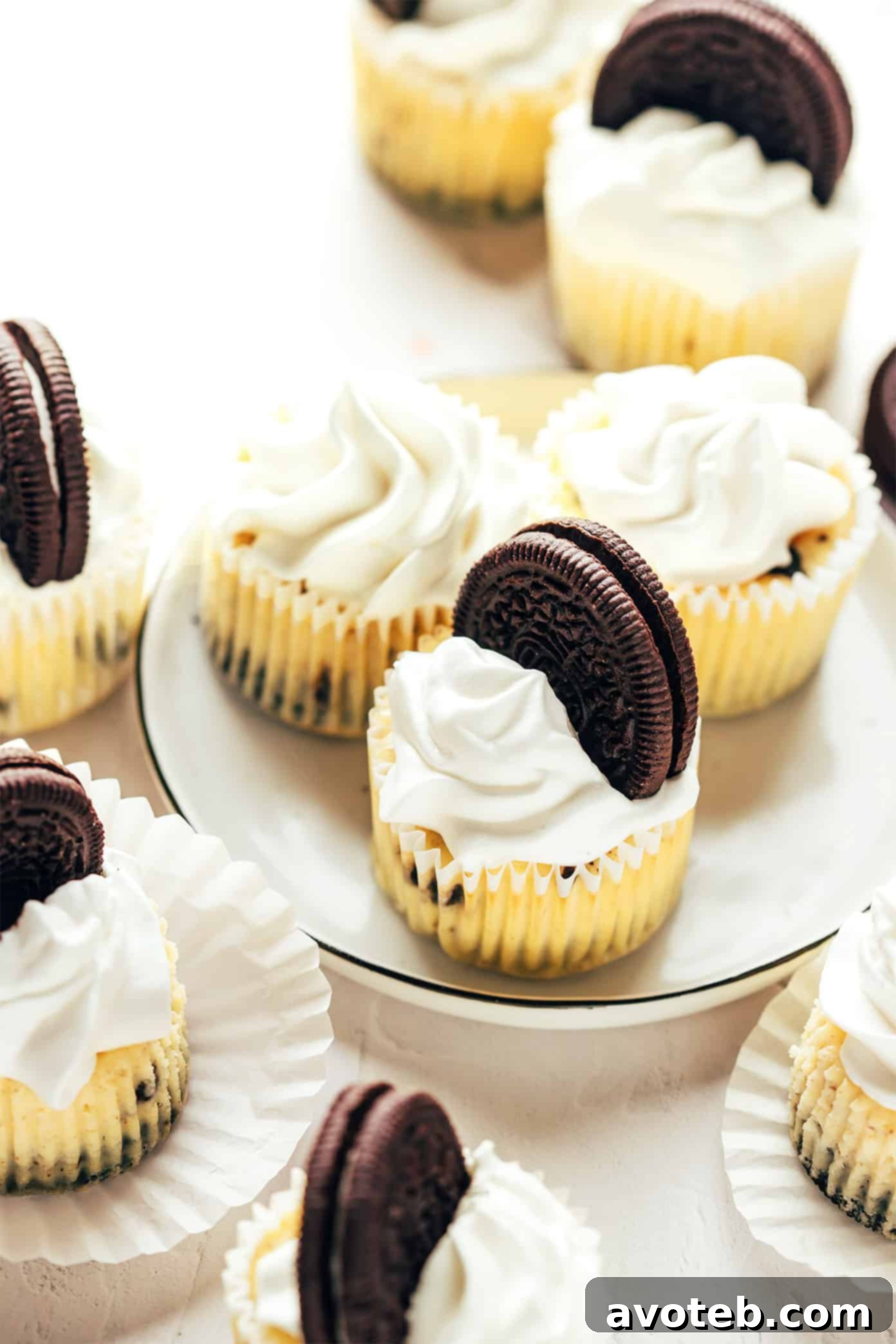 Delicious Mini Oreo Cheesecakes with Oreo crust and whipped cream topping