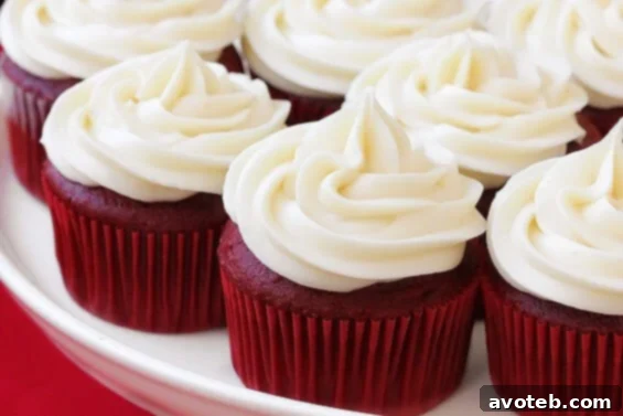 Red Velvet Cupcakes with Cream Cheese Frosting Delicious Red Velvet Cupcakes with Cream Cheese Frosting, beautifully piped