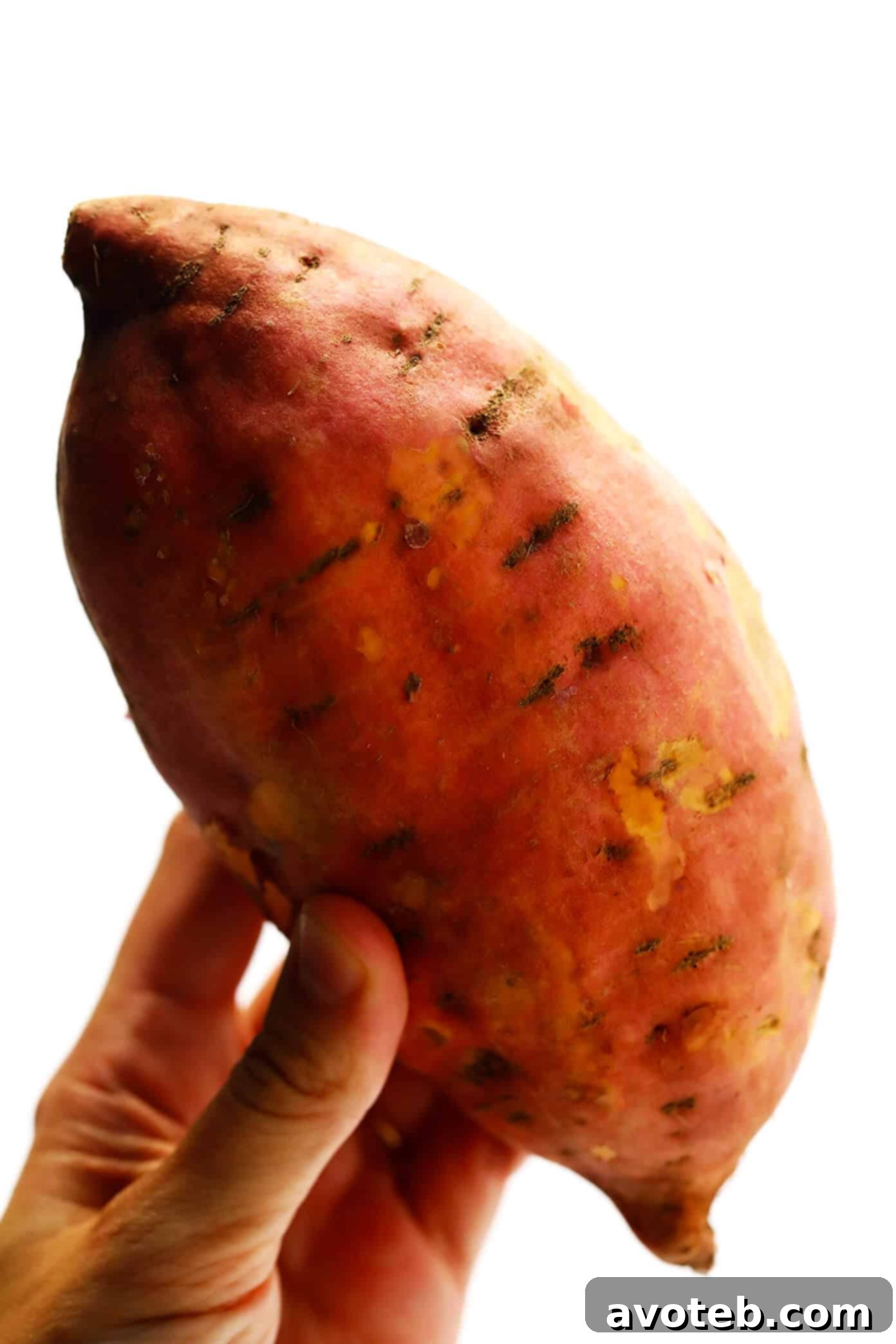 Baked Sweet Potato Fries soaking in cold water – A crucial step for maximum crispiness.