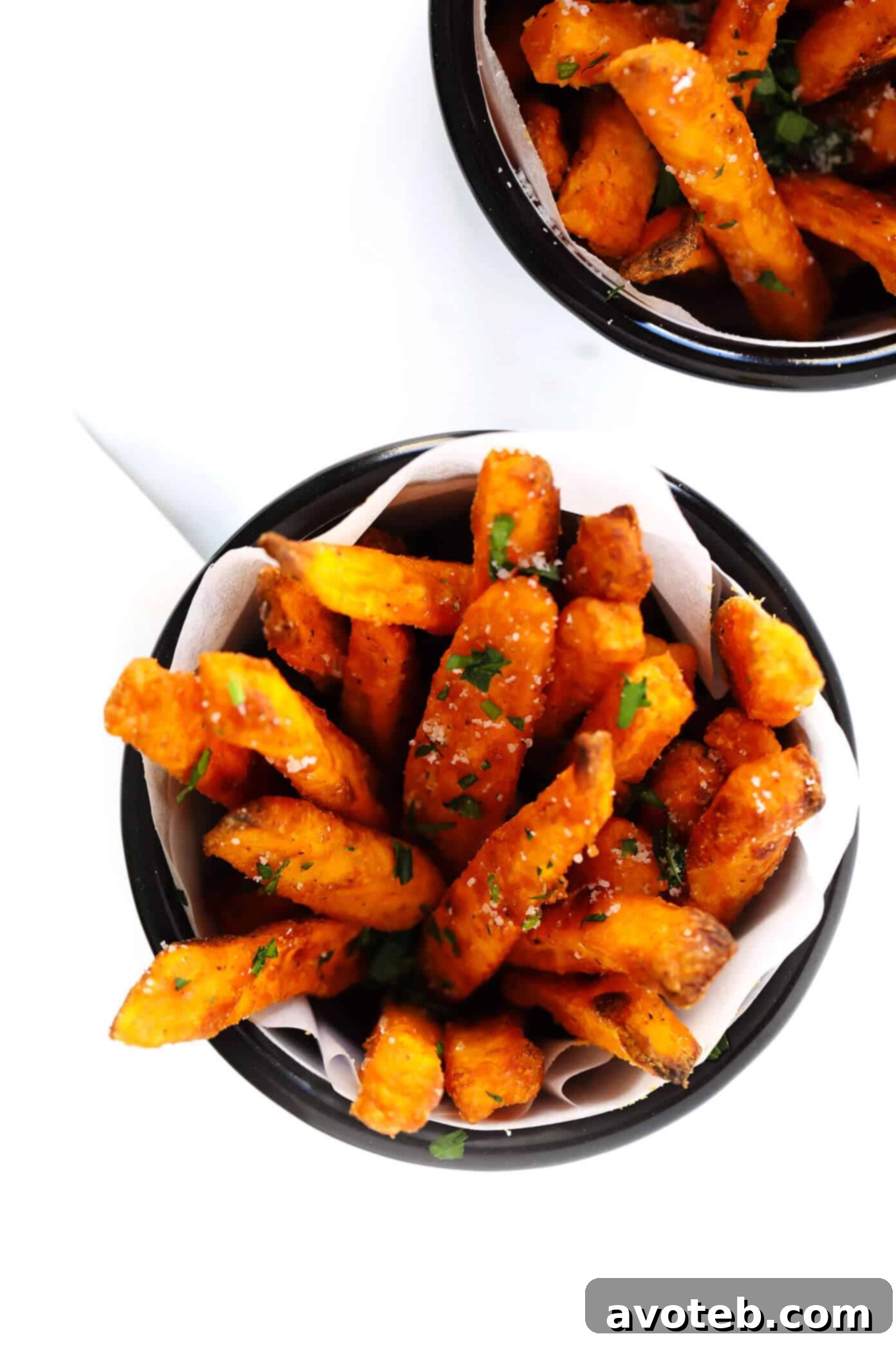 The BEST Crispy Oven-Baked Sweet Potato Fries Recipe - A close-up of perfectly golden and seasoned sweet potato fries.