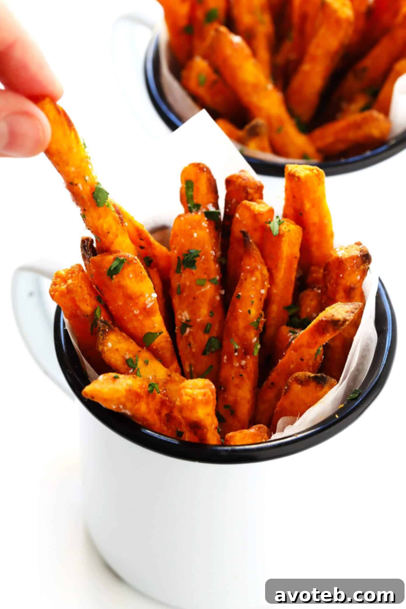 Crispy Sweet Potato Fries Recipe - A large serving of golden baked sweet potato fries, perfectly seasoned.