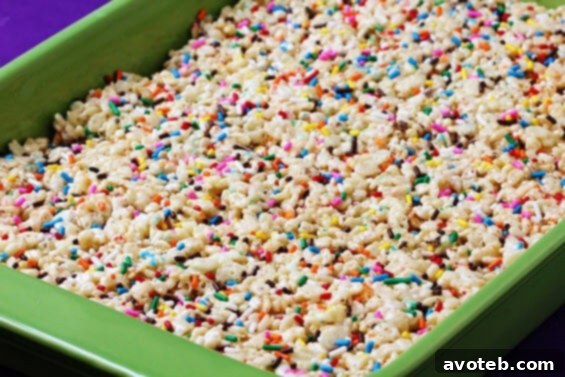 Cake Batter Rice Crispy Treats: A Sweet Delight Close-up of freshly cut Cake Batter Rice Crispy Treats with sprinkles
