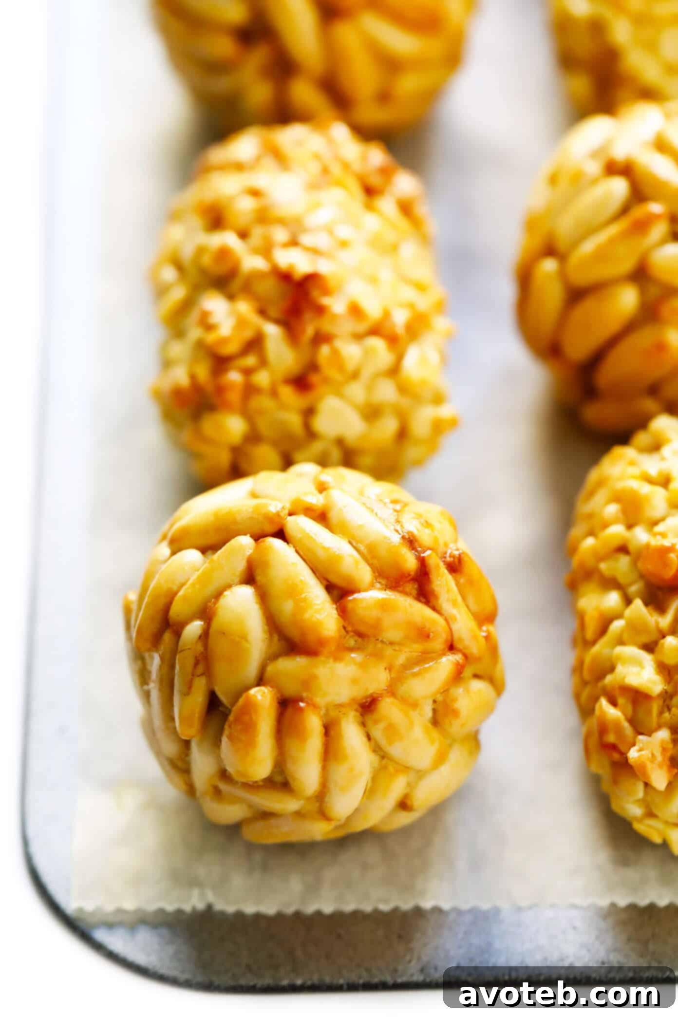 A vibrant selection of homemade Panellets, showcasing different toppings and shapes, beautifully arranged for serving.