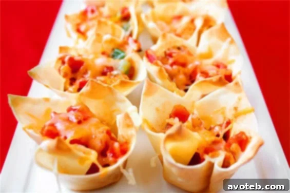 Festive Cinco de Mayo Dishes 2 Chipotle Chicken Cups, a perfect savory appetizer for Cinco de Mayo celebrations, featuring seasoned chicken in crispy cups.