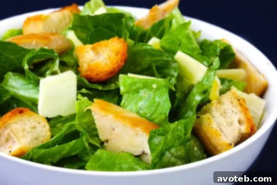 Overhead view of a vibrant Chicken Caesar Salad in a bowl