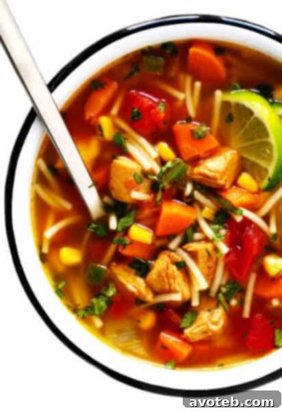 Delicious Mexican Chicken Noodle Soup with fresh cilantro and lime