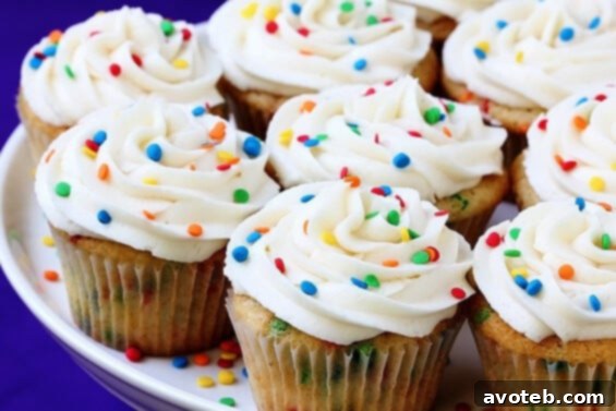 Homemade Funfetti Cupcakes topped with vanilla buttercream and colorful sprinkles