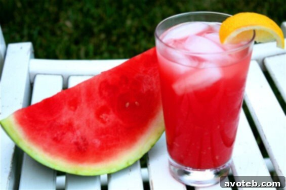 Refreshing Watermelon Lemonade in a pitcher with fresh fruit