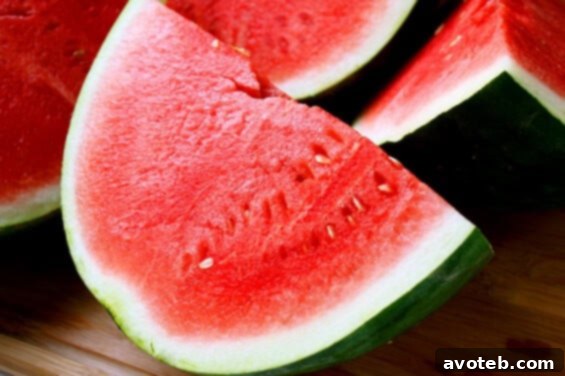 Two watermelons cut open for juicing