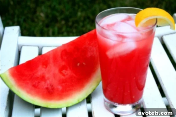 Pitcher of Watermelon Lemonade garnished with lemon and watermelon slices