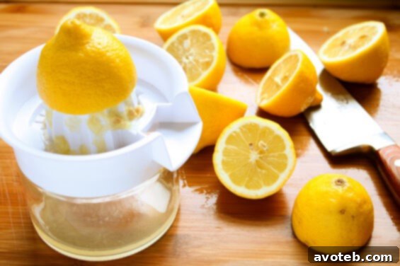 Fresh lemons being squeezed for juice
