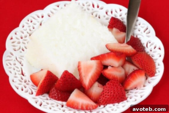Light and fluffy homemade Angel Food Cake with berries and whipped cream.