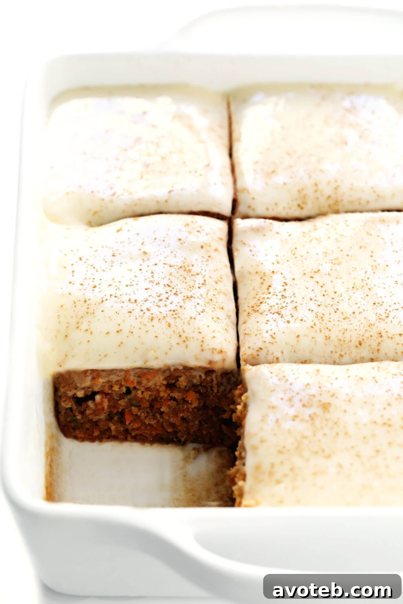 This amazing Carrot Cake Bars recipe is easy to make, perfectly moist and lightly spiced and full of fresh carrots, and topped with the most heavenly cream cheese frosting. Perfect for Easter, spring time, or whenever you happen to be craving this classic dessert! | gimmesomeoven.com #carrot #cake #bars #dessert #creamcheese #frosting #icing #easter #spring #vegetarian #holiday Delicious Carrot Cake Bars with Cream Cheese Frosting