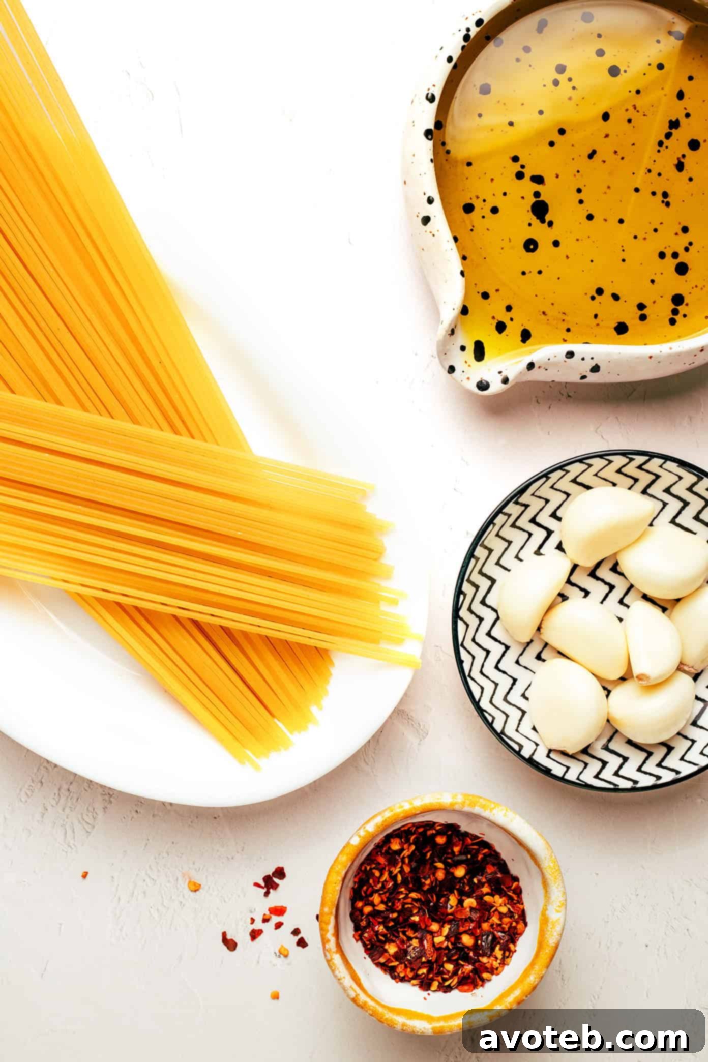 Close-up shot of freshly cooked Spaghetti Aglio e Olio with glistening sauce, ready to be served.