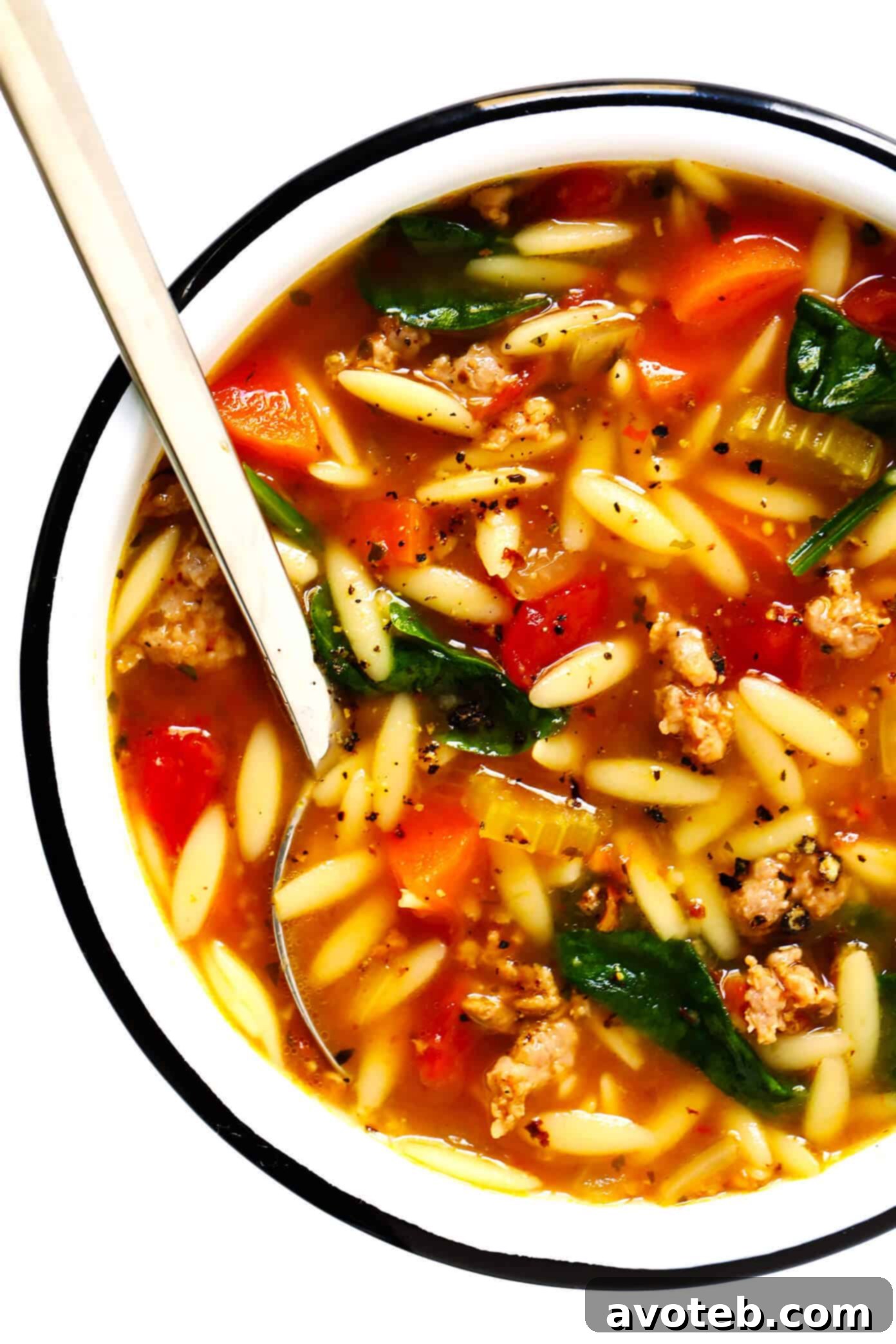 Italian Sausage, Orzo and Spinach Soup - A vibrant bowl of comfort featuring savory sausage, tiny pasta, and fresh greens in a rich, tomato-based broth.