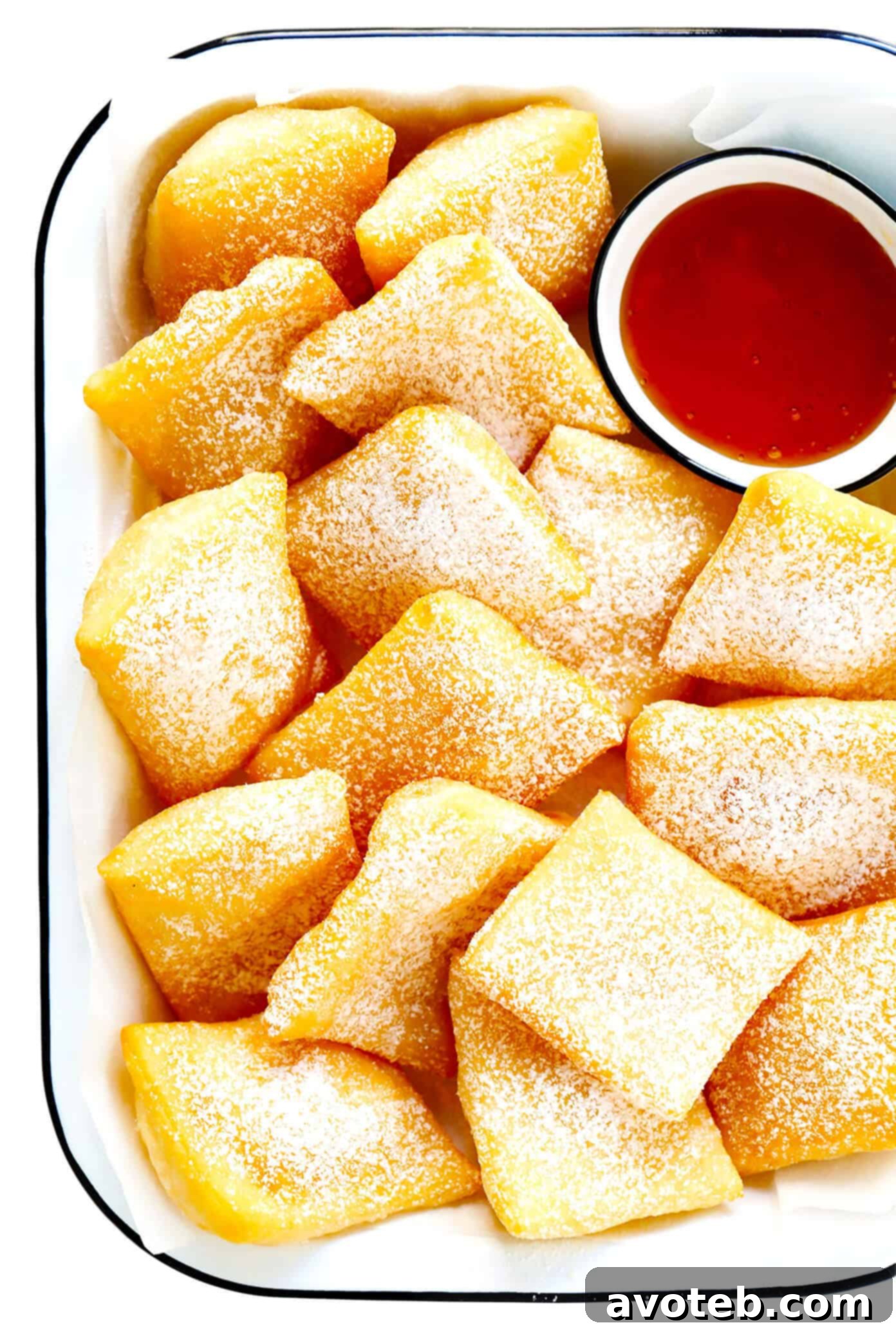 This restaurant-style sopapilla recipe is easy to make at home with pantry ingredients and always a crowd fave. Sprinkle your sopapillas in powdered sugar or dip in cinnamon-sugar -- up to you! | gimmesomeoven.com #sopapillas #dessert #mexican #texmex #donut #frybread #sweet Puffy Golden Sopapillas Ready to Serve