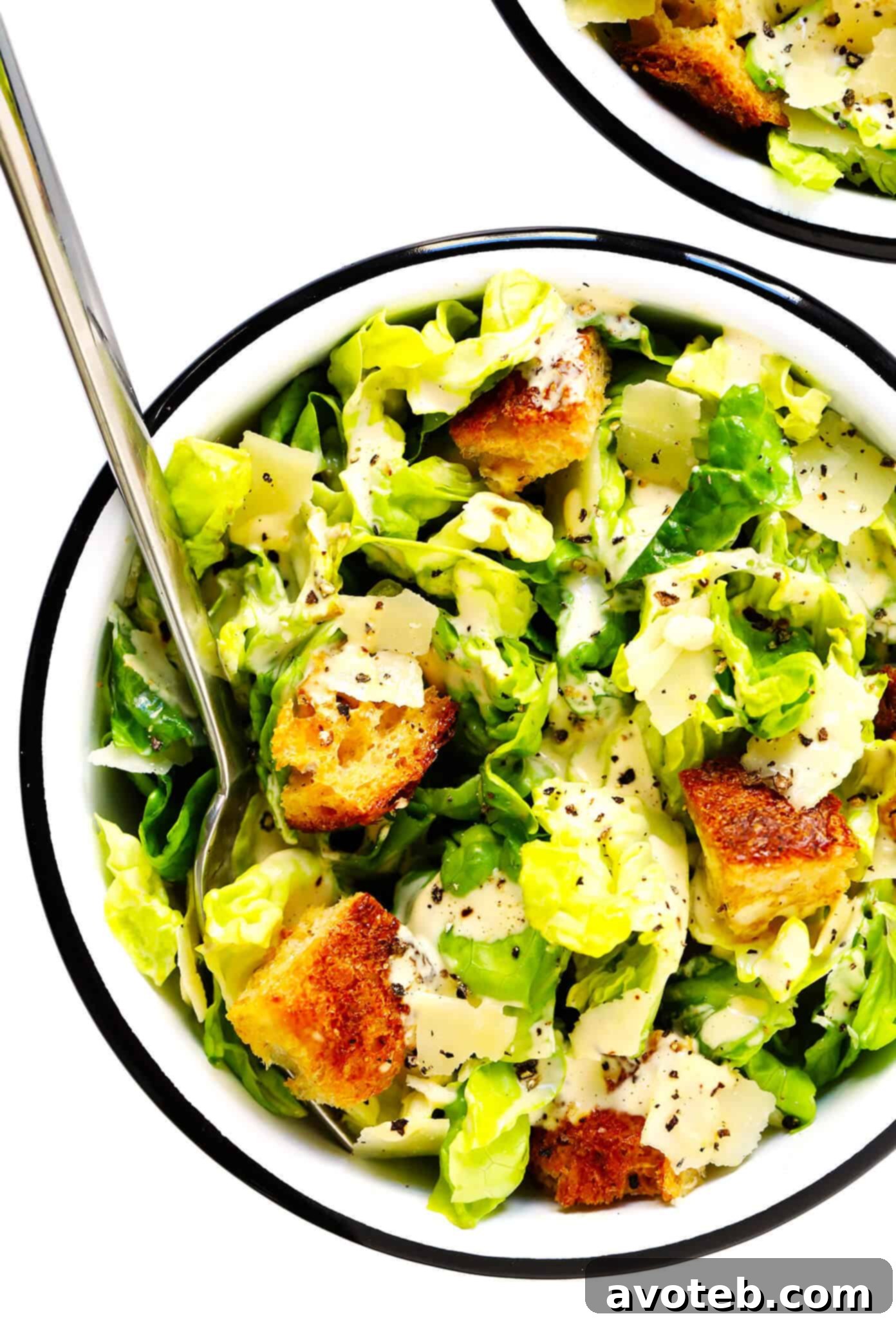The BEST homemade Caesar Salad recipe with crisp lettuce, toasty sourdough croutons, lots of Parmesan cheese, and an all-time favorite homemade Caesar dressing. Add chicken, shrimp, or salmon for a full meal! | gimmesomeoven.com #caesar #salad #dressing #homemade #glutenfree #healthy #summer #italian The Best Homemade Caesar Salad with crisp greens, sourdough croutons, Parmesan, and a delicious dressing.