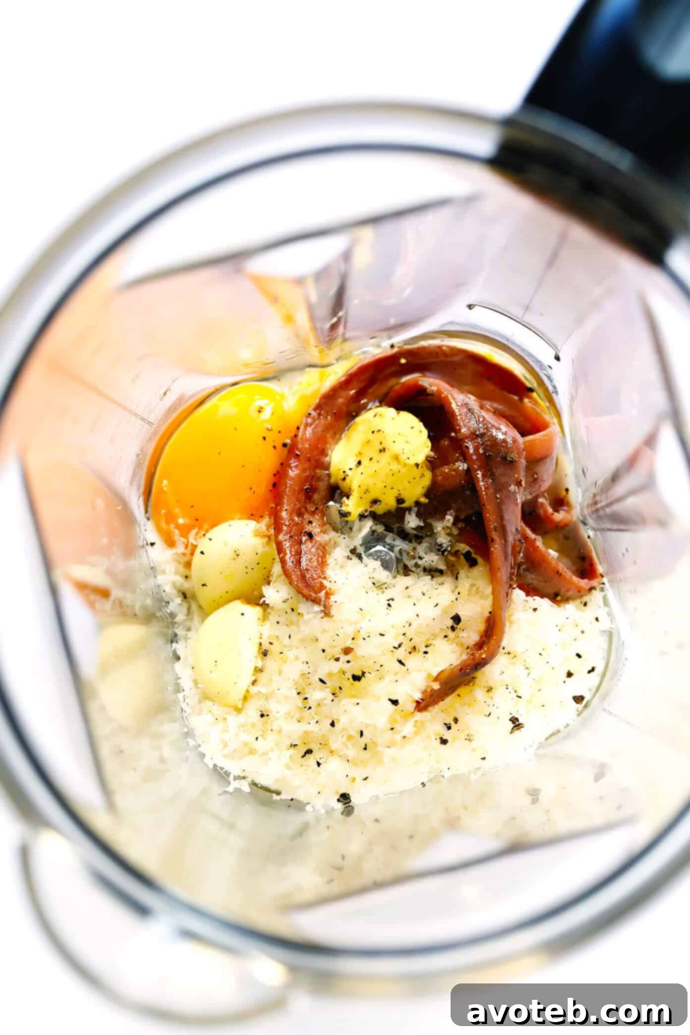 Caesar Dressing Ingredients being blended in a food processor