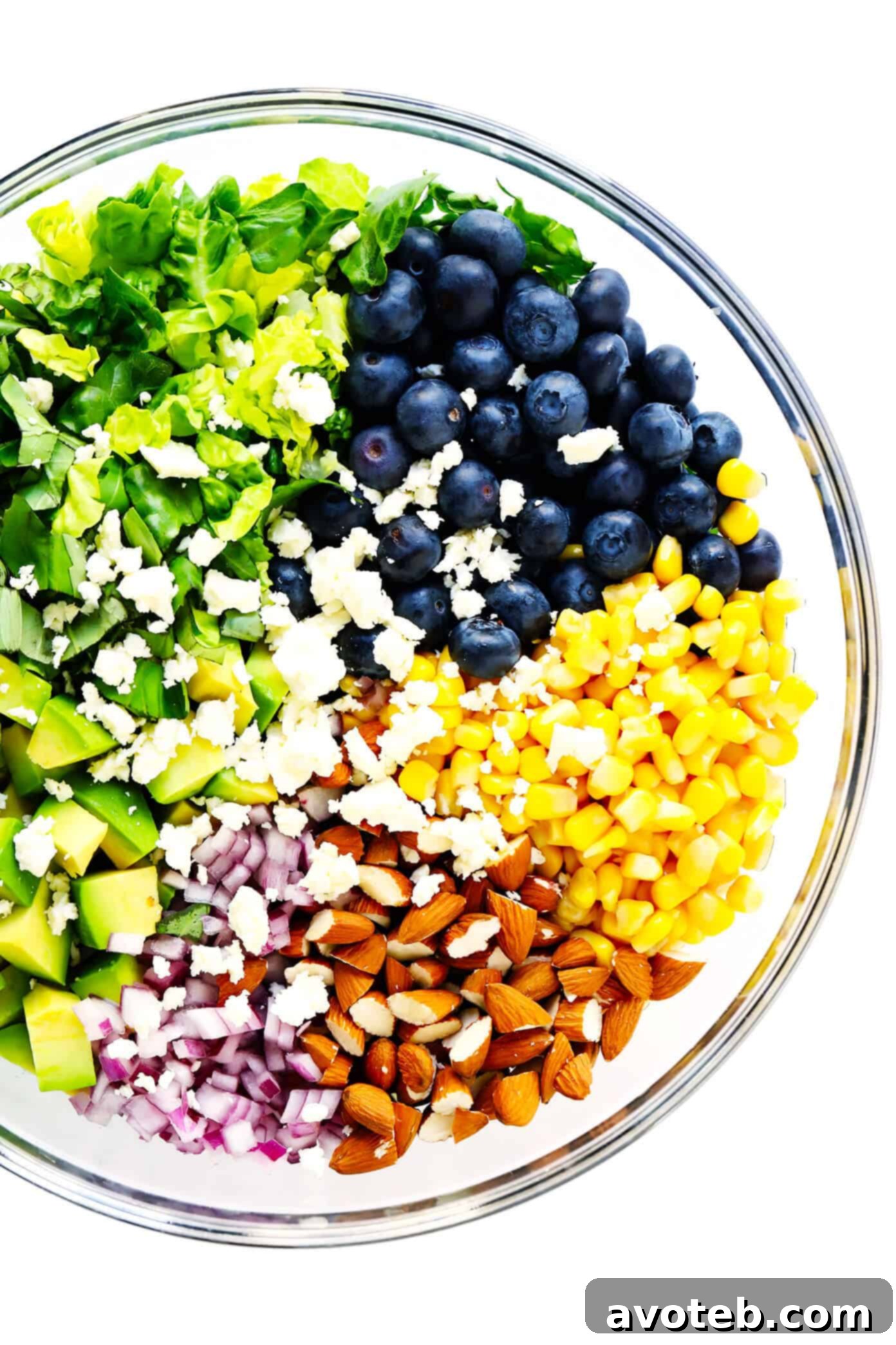 Bowl of ingredients to make blueberry corn and avocado chopped salad