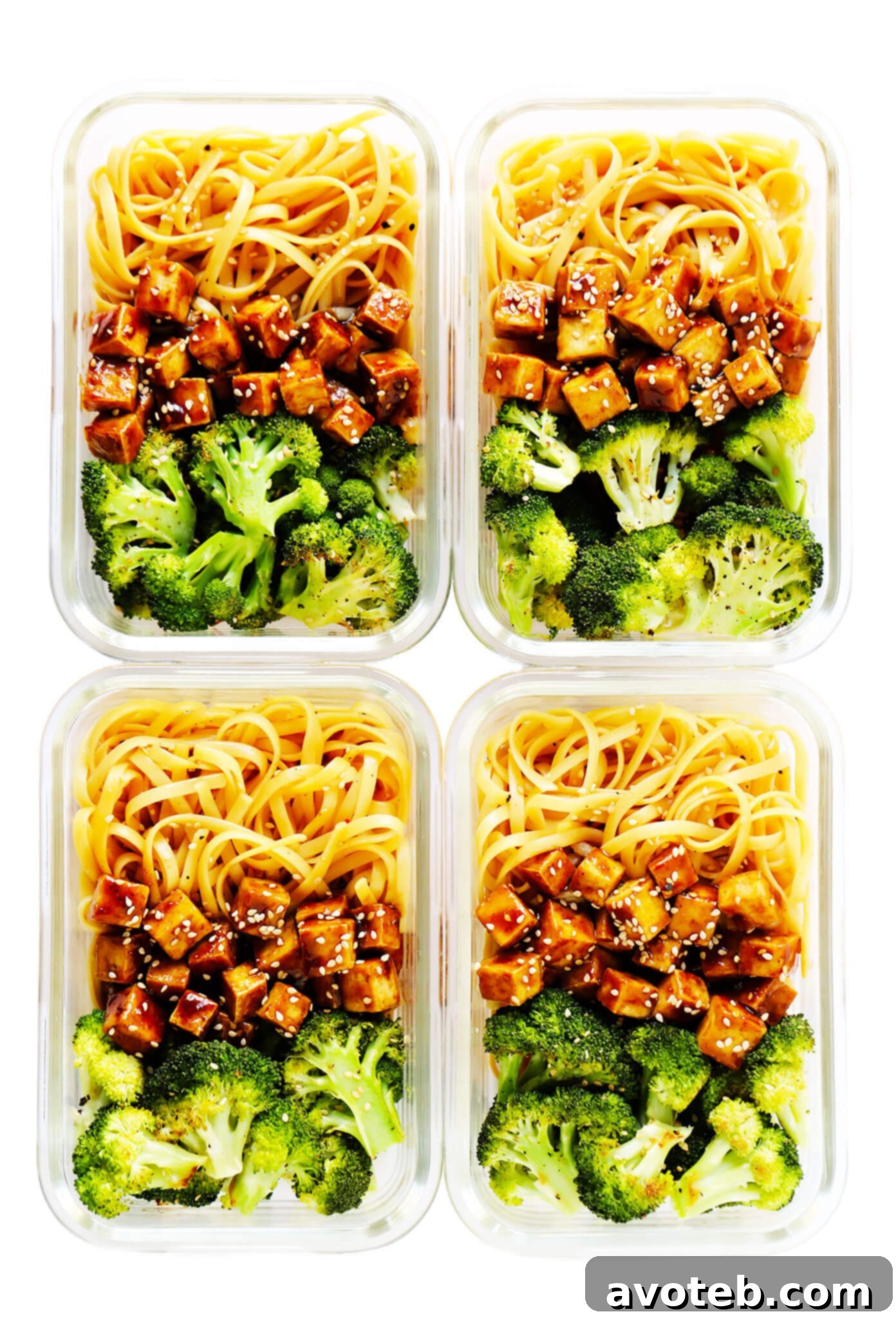 Individual meal prep containers filled with Five Spice Tofu Sesame Noodle Bowls, showcasing their convenience.