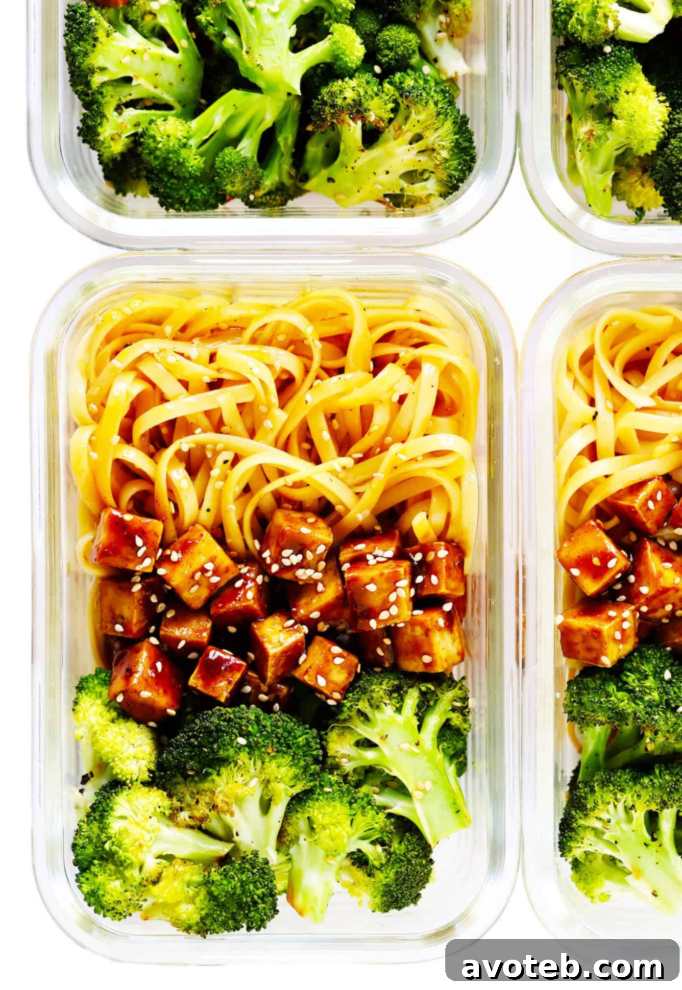 Meal prep containers showing Five Spice Tofu Sesame Noodle Bowls with Roasted Broccoli, ready for the week.