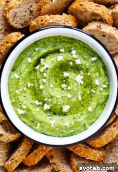 Green Goddess Feta Dip ready to serve with dippers.