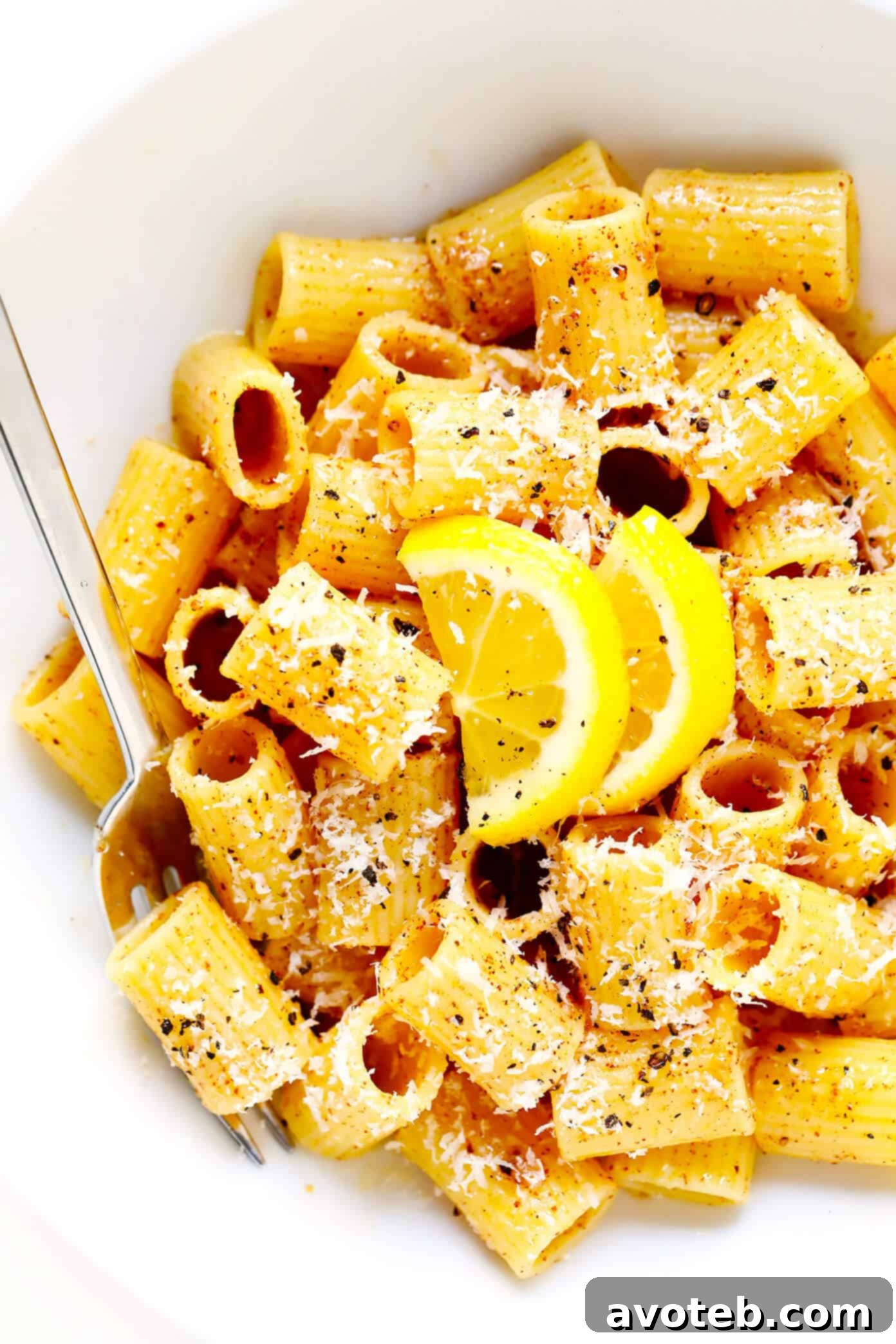 Close-up of Brown Butter Lemon Pasta in a white serving dish, showing the glossy sauce and perfectly cooked pasta.